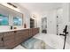 Bright main bathroom features dual vanities, large soaking tub and walk-in shower at 130 Wesley Pl, Fayetteville, GA 30214