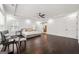Bright main bedroom featuring tray ceilings, hardwood floors, a ceiling fan, and a sliding barn door at 130 Wesley Pl, Fayetteville, GA 30214