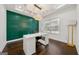 Bright home office featuring a modern desk, chair, and stylish green accent wall at 130 Wesley Pl, Fayetteville, GA 30214