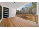 Covered porch with wood decking and decorative railing at 130 Wesley Pl, Fayetteville, GA 30214
