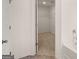 Bathroom with soaking tub and a walk-in closet for storage at 4090 Spencer Ln, Stonecrest, GA 30038