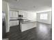 Modern kitchen featuring an island, stainless steel appliances, and ample cabinet space at 4090 Spencer Ln, Stonecrest, GA 30038