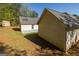 Backyard features a grassy yard, and separate outbuilding at 230 Hidden Brook Trl, Fayetteville, GA 30215