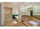 Bathroom features double sinks, granite counters, soaking tub, and walk-in shower at 230 Hidden Brook Trl, Fayetteville, GA 30215