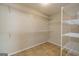 This walk-in closet comes with shelving for maximum storage at 230 Hidden Brook Trl, Fayetteville, GA 30215