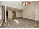 Spacious living room boasts a vaulted ceiling, hardwood floors, and elegant architectural columns at 230 Hidden Brook Trl, Fayetteville, GA 30215