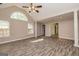 Open living space with hardwood floors, vaulted ceilings, and natural light at 230 Hidden Brook Trl, Fayetteville, GA 30215