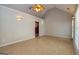 Open sun room with vaulted ceiling, glass doors, and access to a walk-in closet at 230 Hidden Brook Trl, Fayetteville, GA 30215