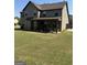 Spacious backyard with a covered patio, perfect for entertaining and relaxation at 110 Broadwater Dr, Fayetteville, GA 30214