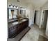 Bathroom with double sinks, tile flooring, and neutral color scheme at 110 Broadwater Dr, Fayetteville, GA 30214