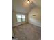 Cozy carpeted bedroom with a large window for natural light at 110 Broadwater Dr, Fayetteville, GA 30214
