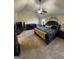 Large bedroom with a ceiling fan and a large bed with patterned bedding and dark furniture at 110 Broadwater Dr, Fayetteville, GA 30214