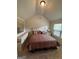 Cozy bedroom with neutral walls and traditional furnishings at 110 Broadwater Dr, Fayetteville, GA 30214