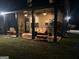 Covered patio with outdoor seating, ceiling fans, and view of the backyard at 110 Broadwater Dr, Fayetteville, GA 30214