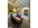 Spacious dining room with hardwood table, chandelier, and views of living areas through arched doorways at 110 Broadwater Dr, Fayetteville, GA 30214