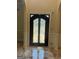 Foyer with a decorative glass door, marble floors, and detailed trim at 110 Broadwater Dr, Fayetteville, GA 30214