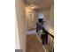 Upstairs hallway featuring a laundry room and bedroom access at 110 Broadwater Dr, Fayetteville, GA 30214