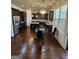 A gourmet kitchen with dark wood cabinets, granite countertops, and stainless steel appliances at 110 Broadwater Dr, Fayetteville, GA 30214