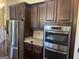 Close-up of modern kitchen appliances and cabinets with granite countertops in a stylish design at 110 Broadwater Dr, Fayetteville, GA 30214