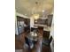A gourmet kitchen with dark wood cabinets, granite countertops, and stainless steel appliances at 110 Broadwater Dr, Fayetteville, GA 30214