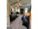 An inviting living room featuring coffered ceilings, a fireplace, and comfortable leather seating at 110 Broadwater Dr, Fayetteville, GA 30214