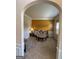Cozy living room featuring a decorative sofa and table with a bright yellow accent wall at 110 Broadwater Dr, Fayetteville, GA 30214