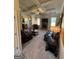An inviting living room featuring coffered ceilings, a fireplace, and comfortable leather seating at 110 Broadwater Dr, Fayetteville, GA 30214
