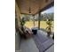Covered patio featuring a comfortable wicker sofa, and fire pit with a scenic view at 110 Broadwater Dr, Fayetteville, GA 30214