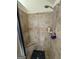 Shower with tiled walls, seating and chrome fixtures at 110 Broadwater Dr, Fayetteville, GA 30214