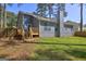 Backyard featuring a raised wooden deck, perfect for outdoor entertaining at 9689 Pintail Trl, Jonesboro, GA 30238
