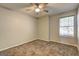 Bedroom with neutral-colored walls, carpet, ceiling fan and window with blinds at 9689 Pintail Trl, Jonesboro, GA 30238