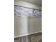 Empty carpeted closet with installed rack and modern light-blue design board at 9689 Pintail Trl, Jonesboro, GA 30238