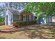 Charming home featuring a mix of brick and gray siding, complemented by a well-maintained lawn and attached garage at 9689 Pintail Trl, Jonesboro, GA 30238