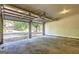Open garage door revealing the driveway and front exterior of the home at 9689 Pintail Trl, Jonesboro, GA 30238