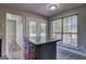 Bright eat-in kitchen featuring gray cabinets, stainless appliances, and granite countertops at 9689 Pintail Trl, Jonesboro, GA 30238