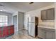 Galley kitchen features modern appliances and granite countertops at 9689 Pintail Trl, Jonesboro, GA 30238