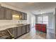 Stylish kitchen with granite countertops, stainless steel appliances, and center island that opens to the backyard at 9689 Pintail Trl, Jonesboro, GA 30238