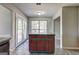 Kitchen island adjacent to open kitchen and French doors at 9689 Pintail Trl, Jonesboro, GA 30238