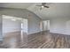 Spacious living room with vaulted ceiling and a ceiling fan with wood laminate flooring at 9689 Pintail Trl, Jonesboro, GA 30238