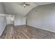 Bright living room with hardwood floors, vaulted ceiling, and a ceiling fan at 9689 Pintail Trl, Jonesboro, GA 30238