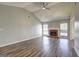 Open living room features vaulted ceilings, wood floors, and a fireplace at 9689 Pintail Trl, Jonesboro, GA 30238
