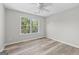 Bedroom with abundant natural light and neutral paint with a ceiling fan at 3540 Owl Brow Ct, Cumming, GA 30028