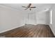 Bright, empty bedroom with wood floors and ceiling fan at 3540 Owl Brow Ct, Cumming, GA 30028