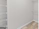 Walk-in closet with white wire shelving and neutral paint at 3540 Owl Brow Ct, Cumming, GA 30028