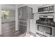 Kitchen with stainless steel appliances including refrigerator, microwave, and stove oven at 3540 Owl Brow Ct, Cumming, GA 30028