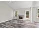 Inviting living room featuring a fireplace, wood-look floors and lots of light at 3540 Owl Brow Ct, Cumming, GA 30028