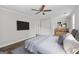 Bedroom featuring a ceiling fan, and closet at 3540 Owl Brow Ct, Cumming, GA 30028