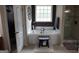 Relaxing bathroom featuring a soaking tub, separate shower, and elegant fixtures at 480 Meadow Sage Ln, Fayetteville, GA 30214