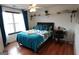 Bright bedroom featuring a ceiling fan, window, and contemporary decor at 480 Meadow Sage Ln, Fayetteville, GA 30214