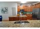 Well-equipped kitchen with stainless steel appliances, granite countertops, and a functional island at 480 Meadow Sage Ln, Fayetteville, GA 30214